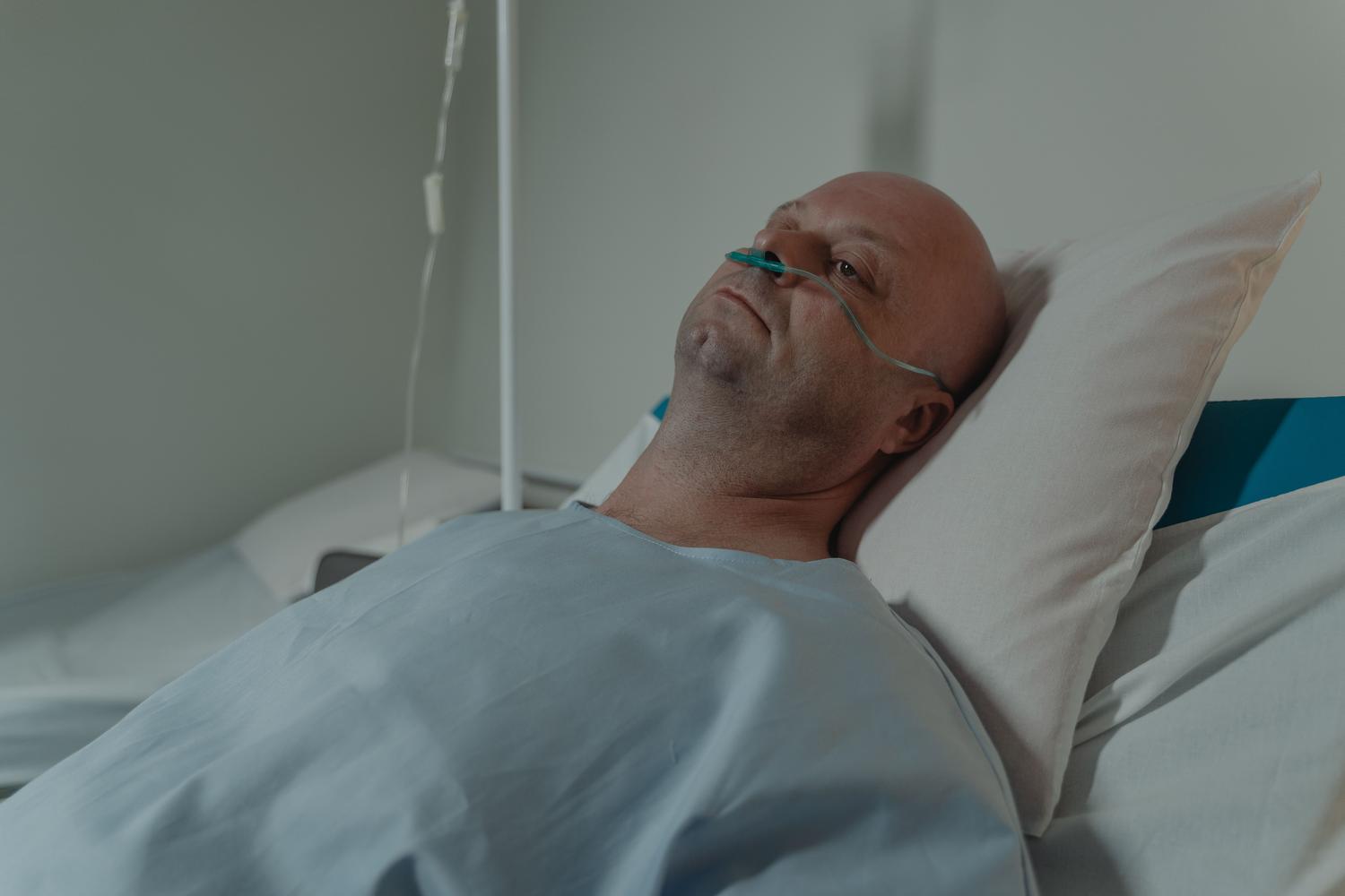 Patient undergoing chemotherapy treatment for multiple myeloma in a controlled hospital environment.